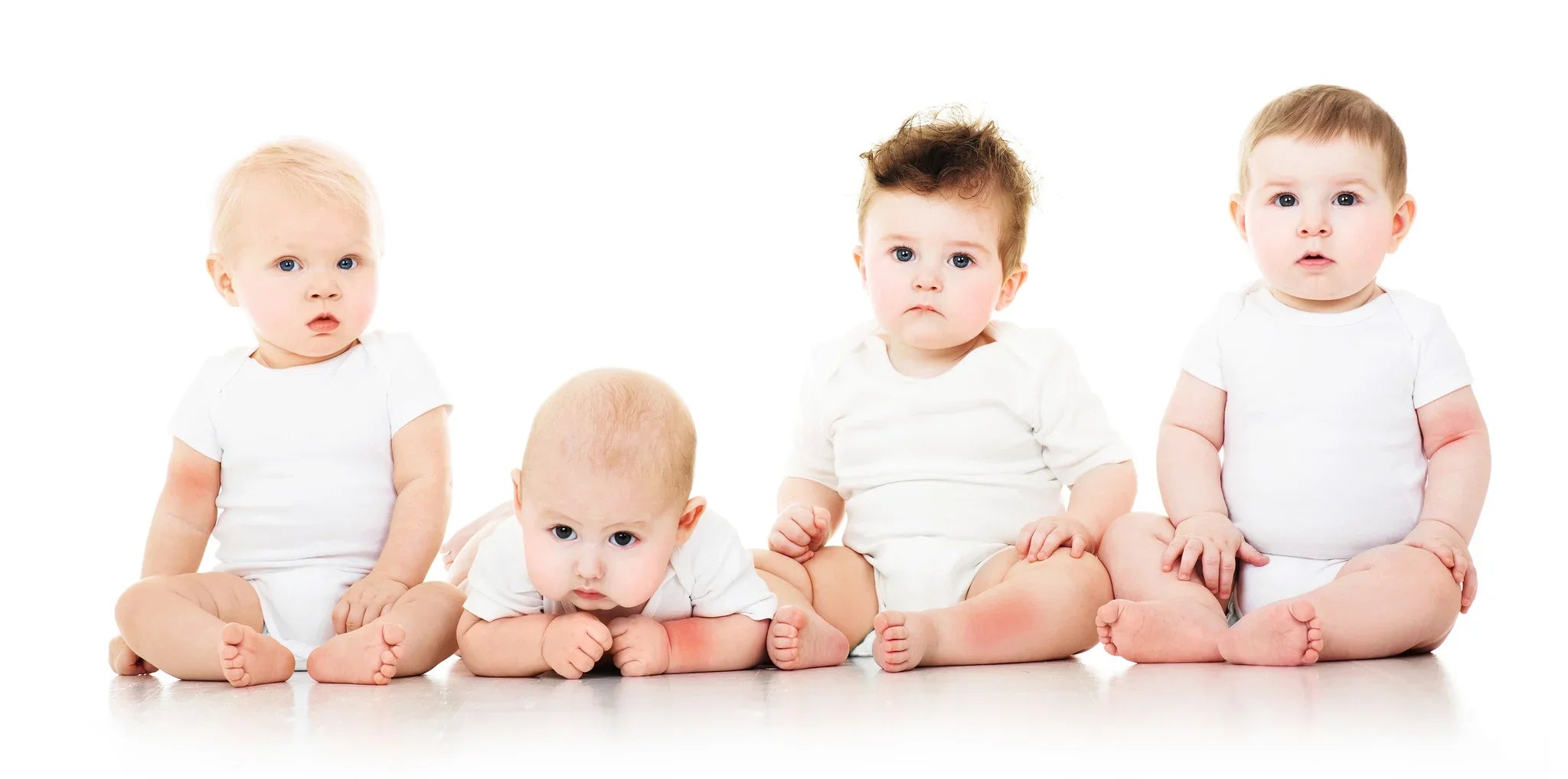 Four babies in white allergy-free cotton bodysuits on a white background, Cottonique apparel