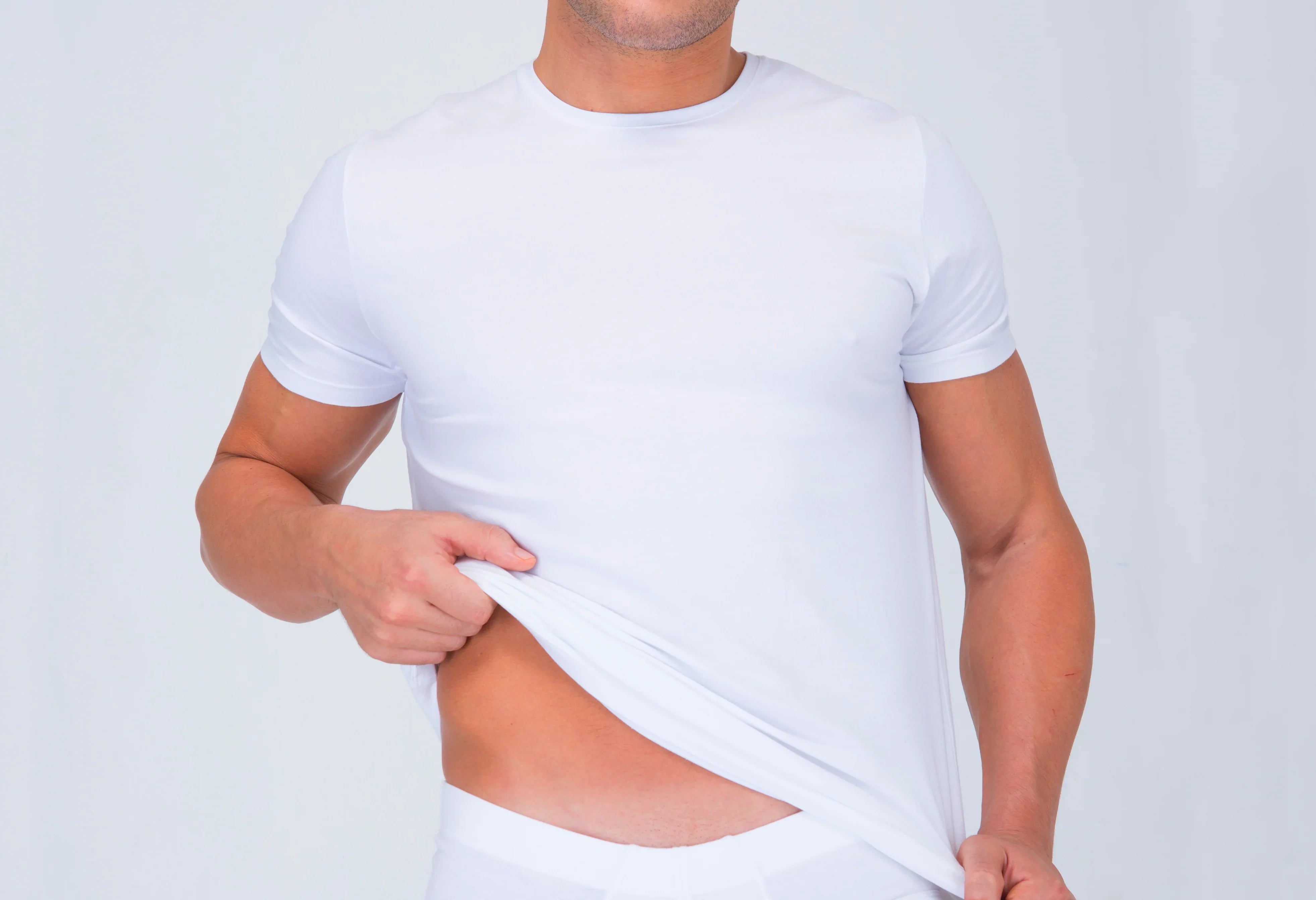Man wearing white organic cotton allergy-free t-shirt and underwear for sensitive skin