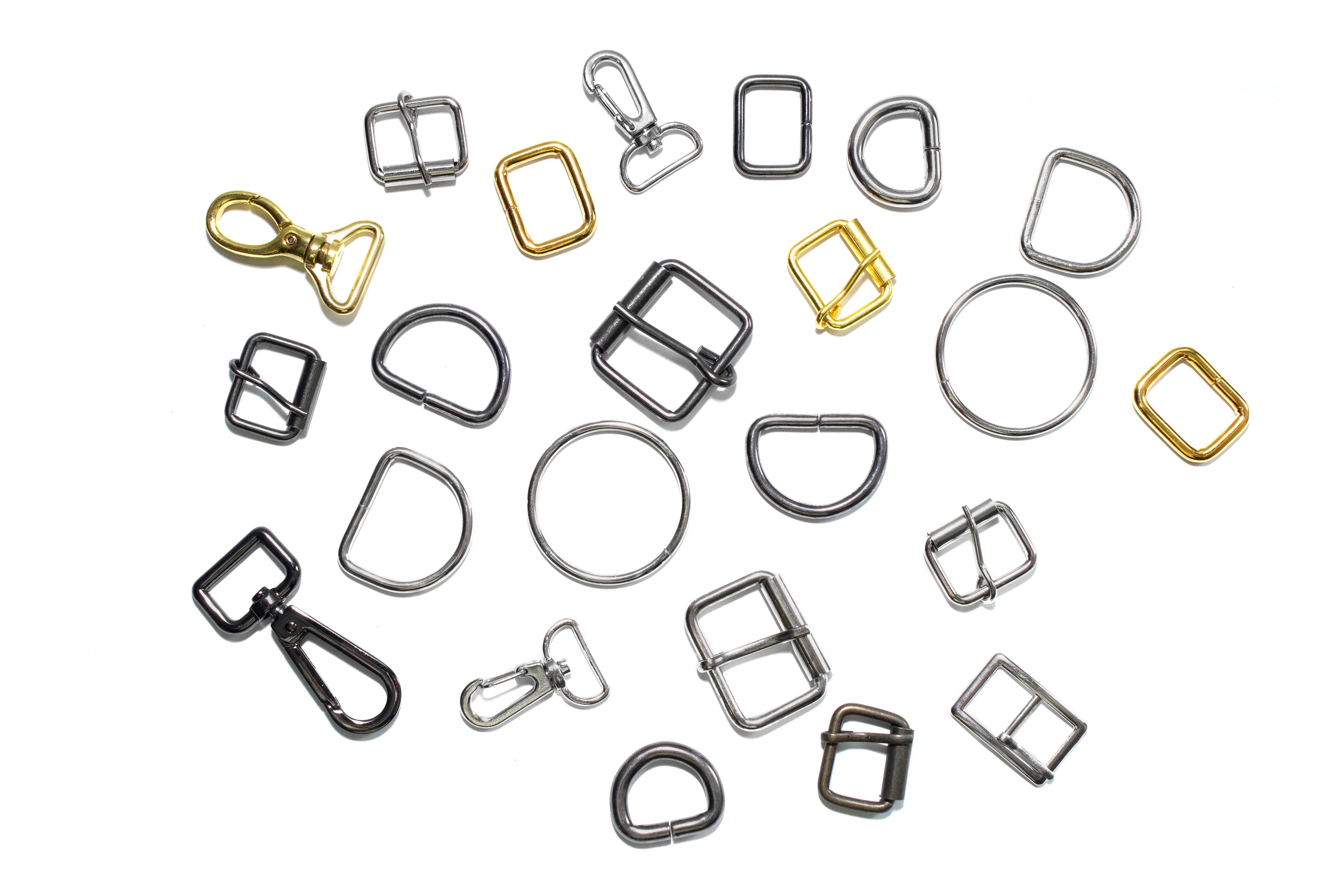Assorted metal buckles and hooks for hypoallergenic apparel on white background