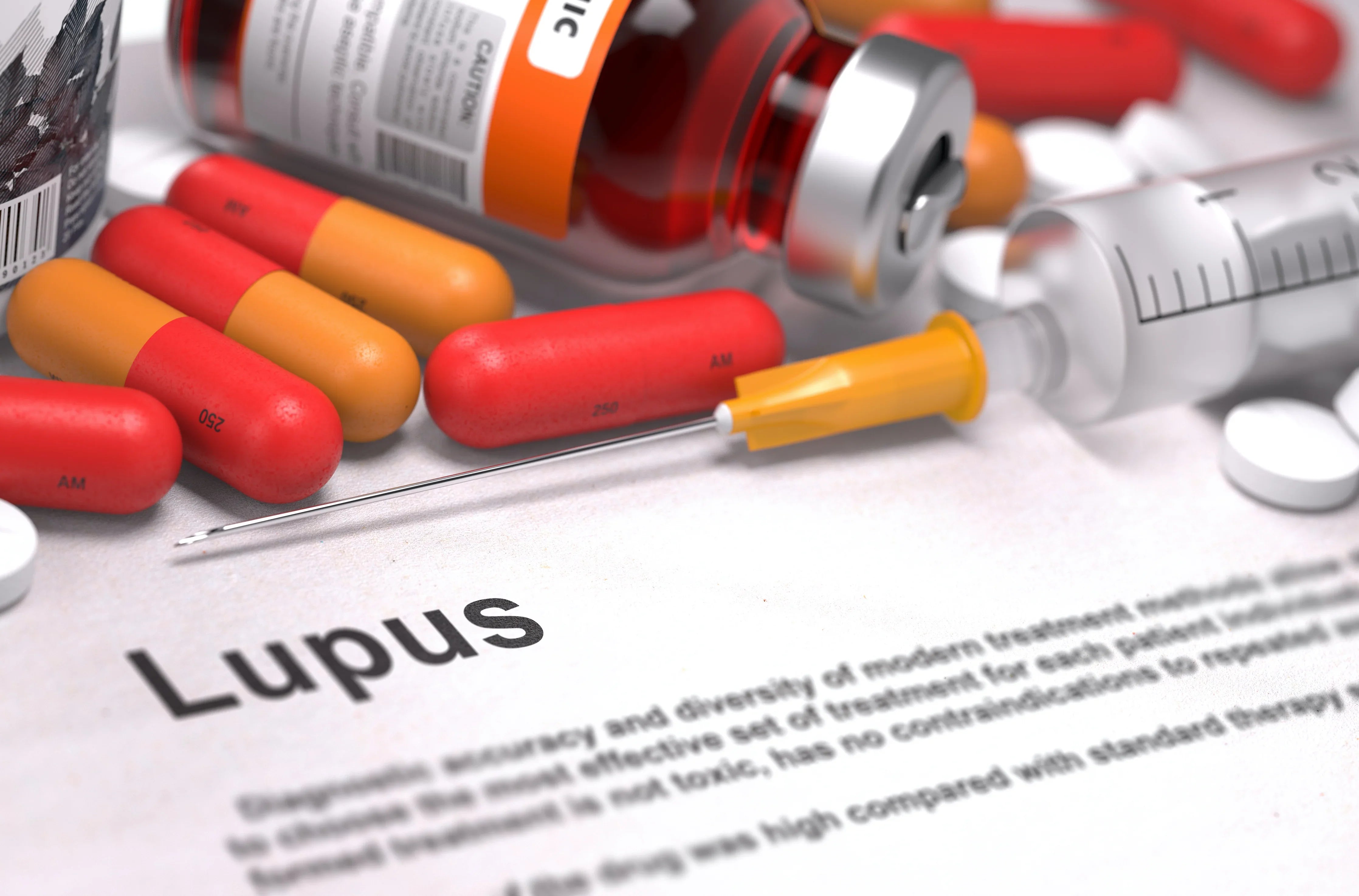 Lupus medication concept with capsules, syringe, pill bottle, and syringe on a document labeled Lupus.