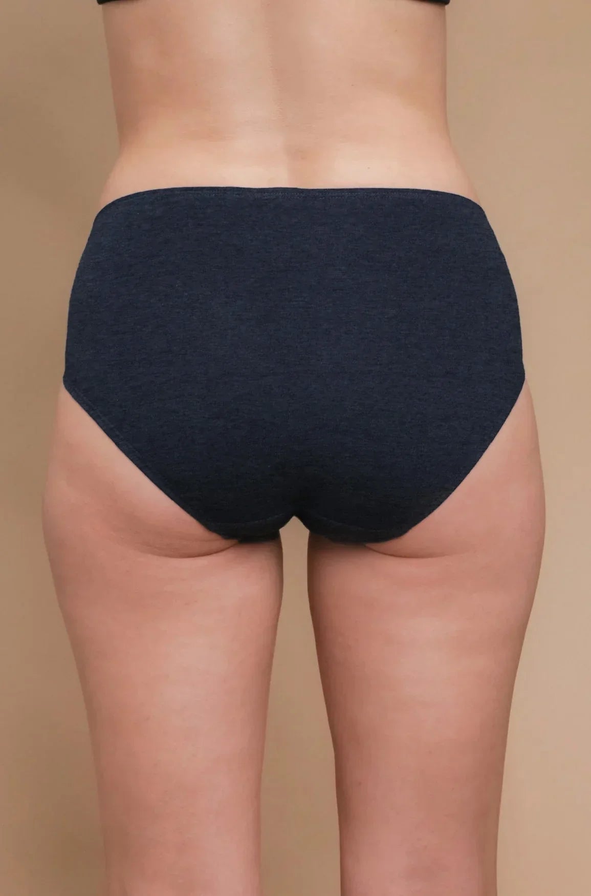Back view of person wearing navy blue hypoallergenic cotton underwear from Cottonique