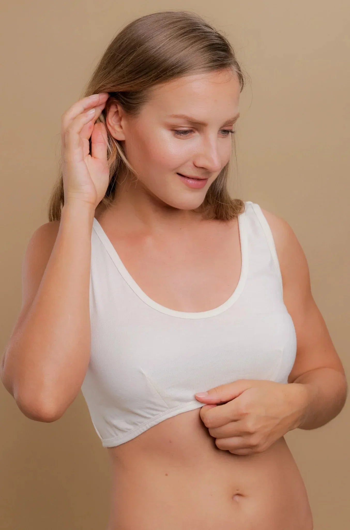 Woman wearing a white organic cotton allergy-friendly bralette for sensitive skin