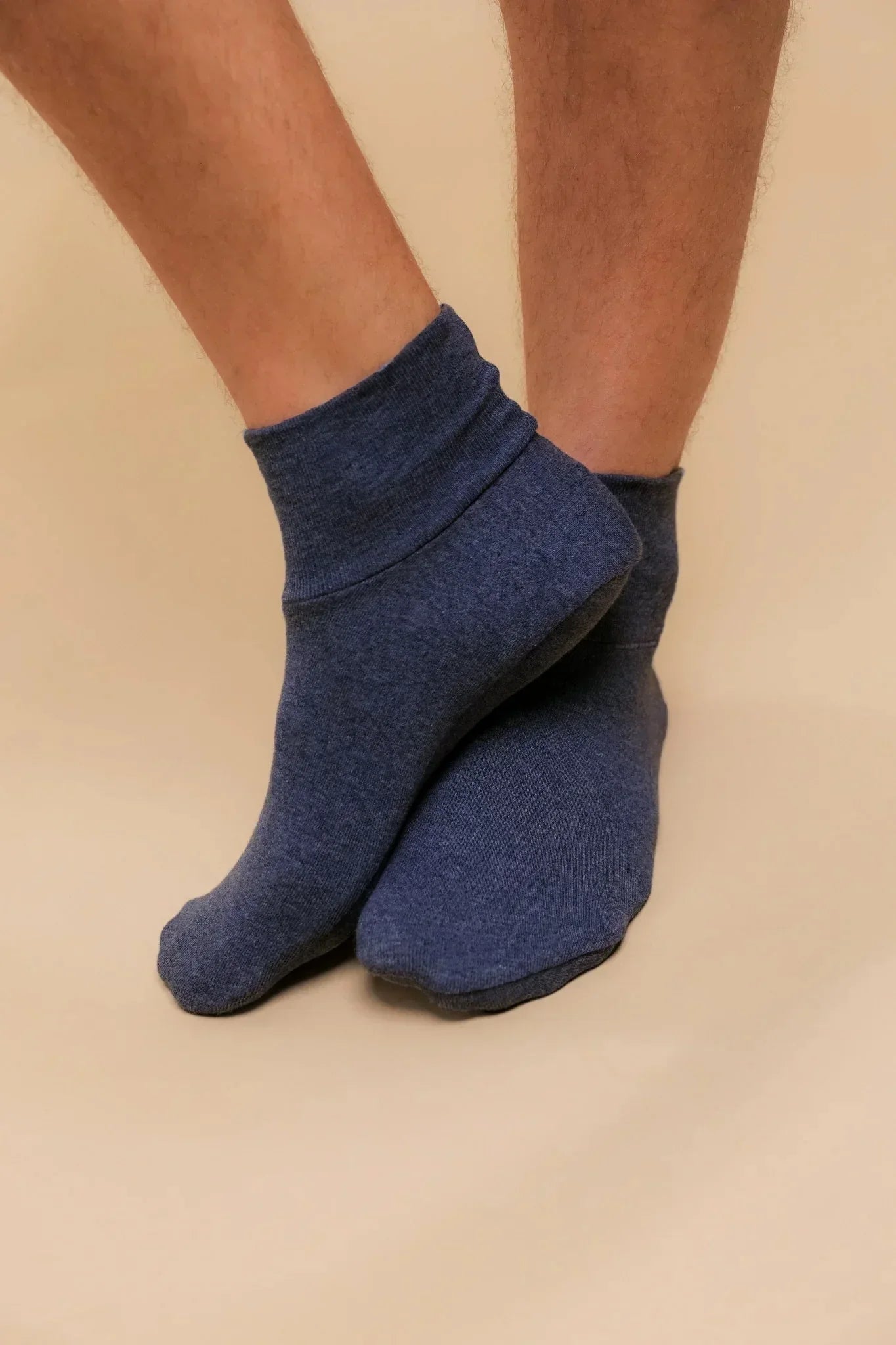 Blue hypoallergenic cotton ankle socks worn on feet, Cottonique allergy-free apparel