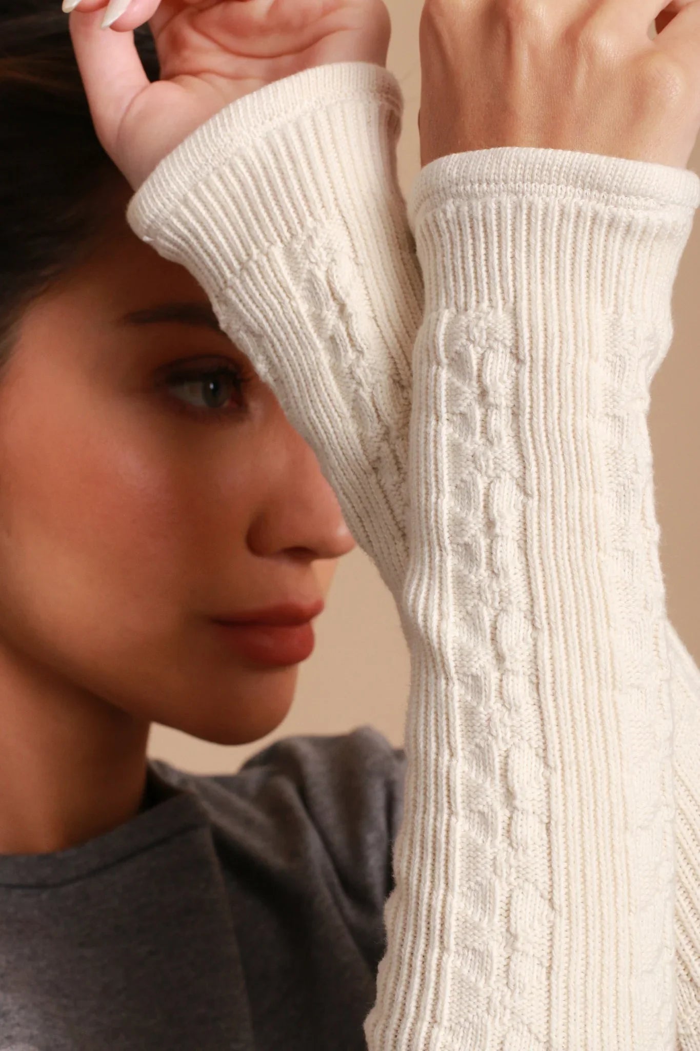 Woman wearing cream ribbed hypoallergenic cotton sleeves, Cottonique allergy-free apparel
