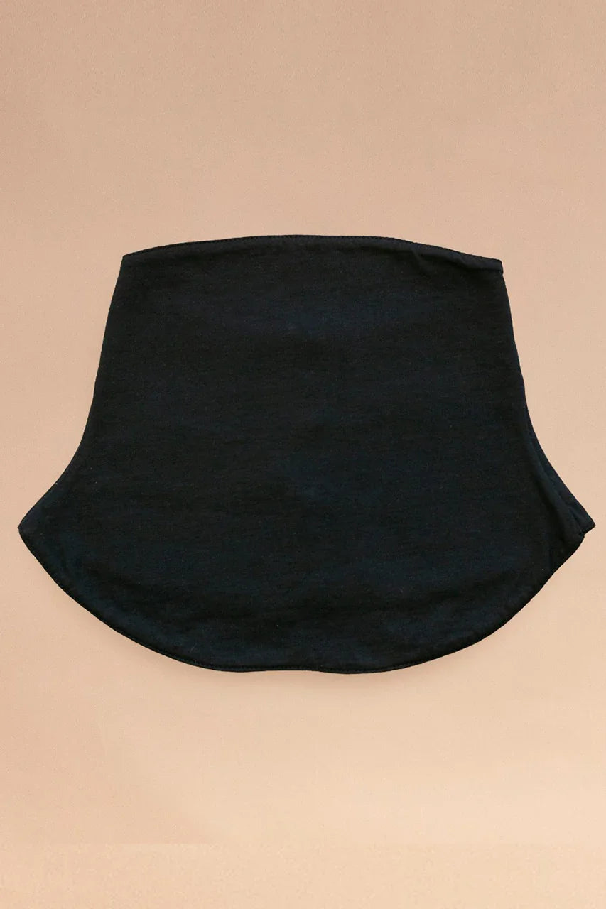 Black hypoallergenic cotton neck gaiter on beige background, Cottonique allergy-free apparel