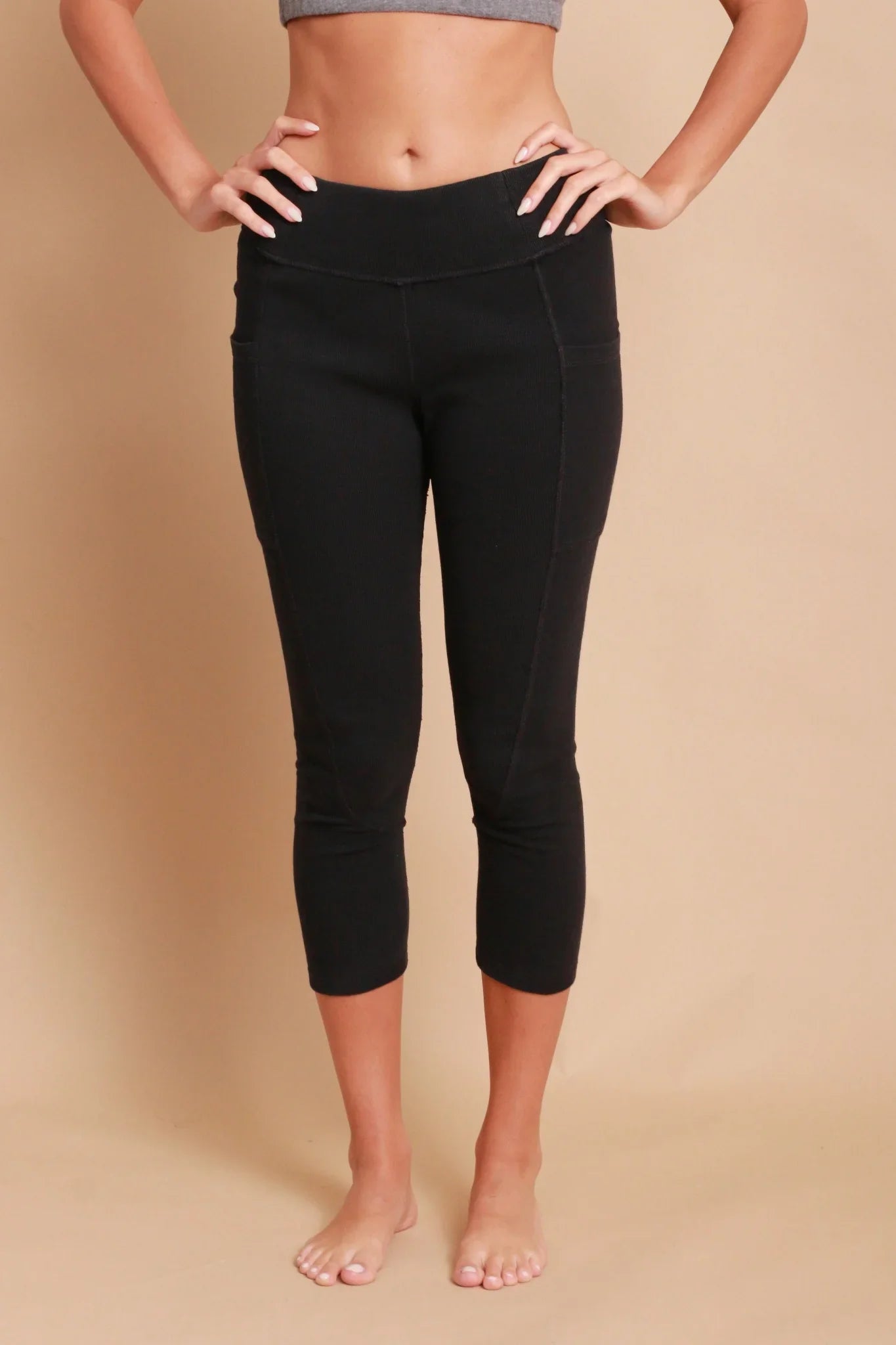 Woman wearing black organic cotton cropped leggings for sensitive skin