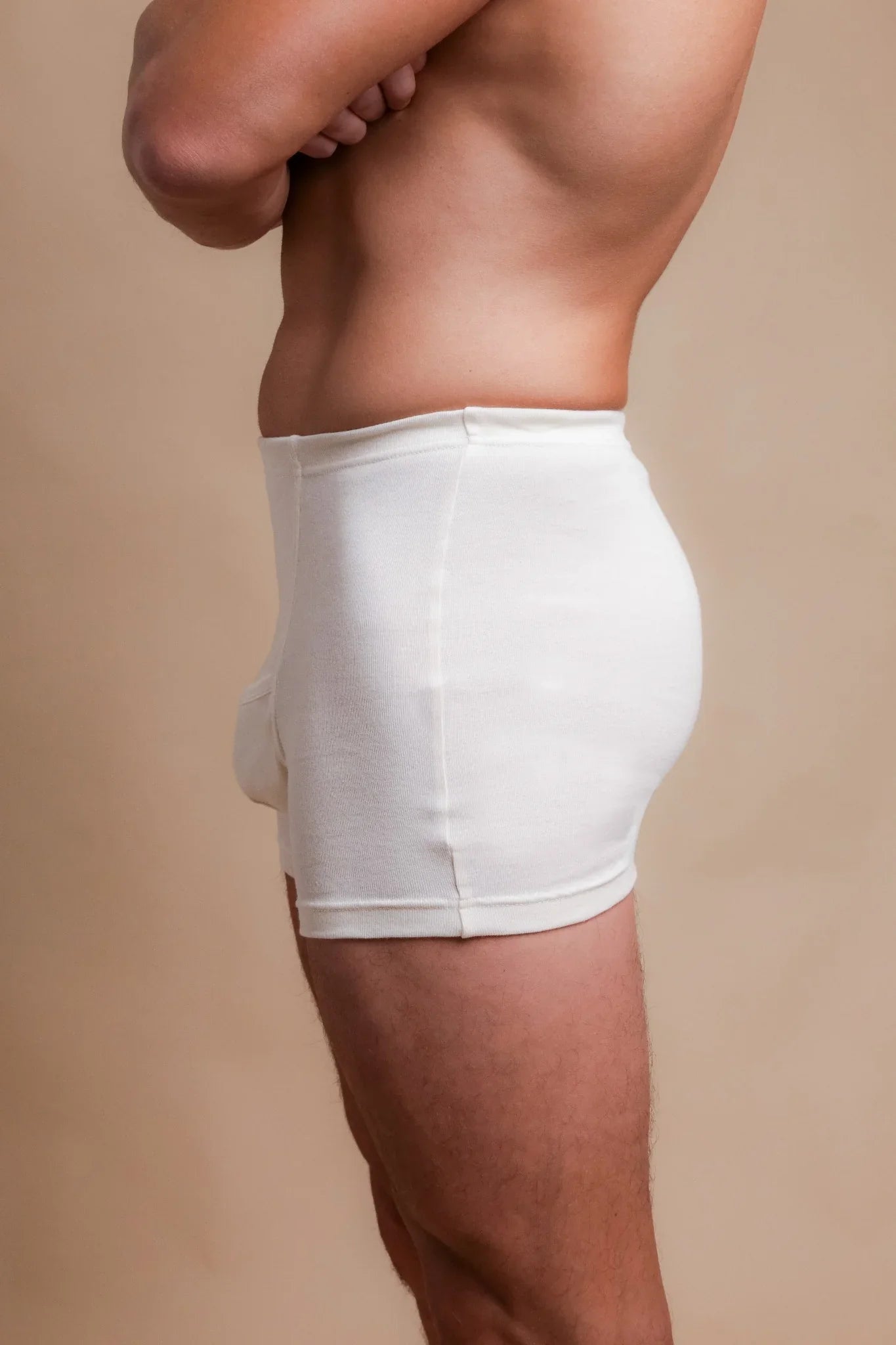 Side view of a man wearing hypoallergenic cotton underwear, allergy-free apparel by Cottonique.